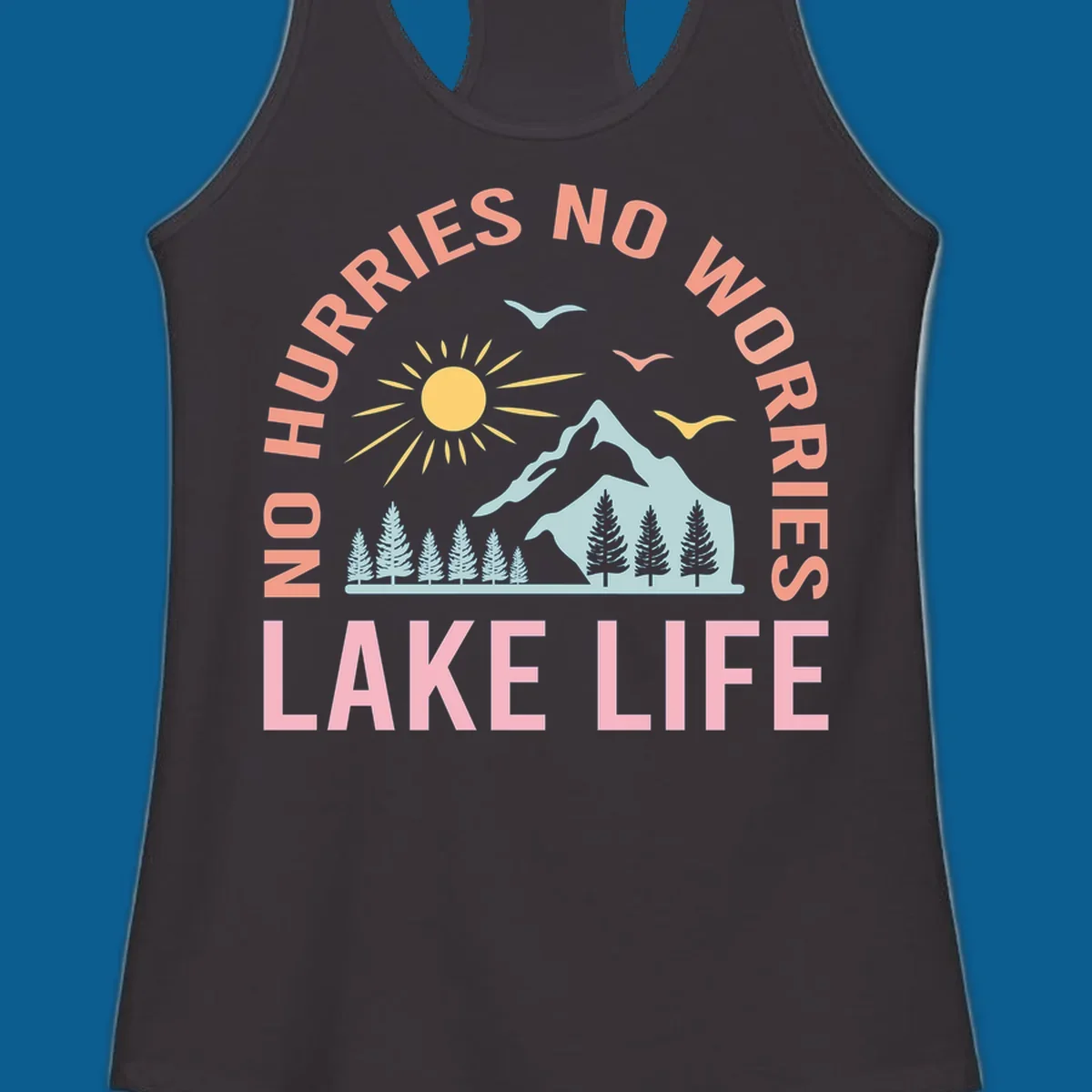 Lake life scenic design with mountains, sun, trees, and no worries text.