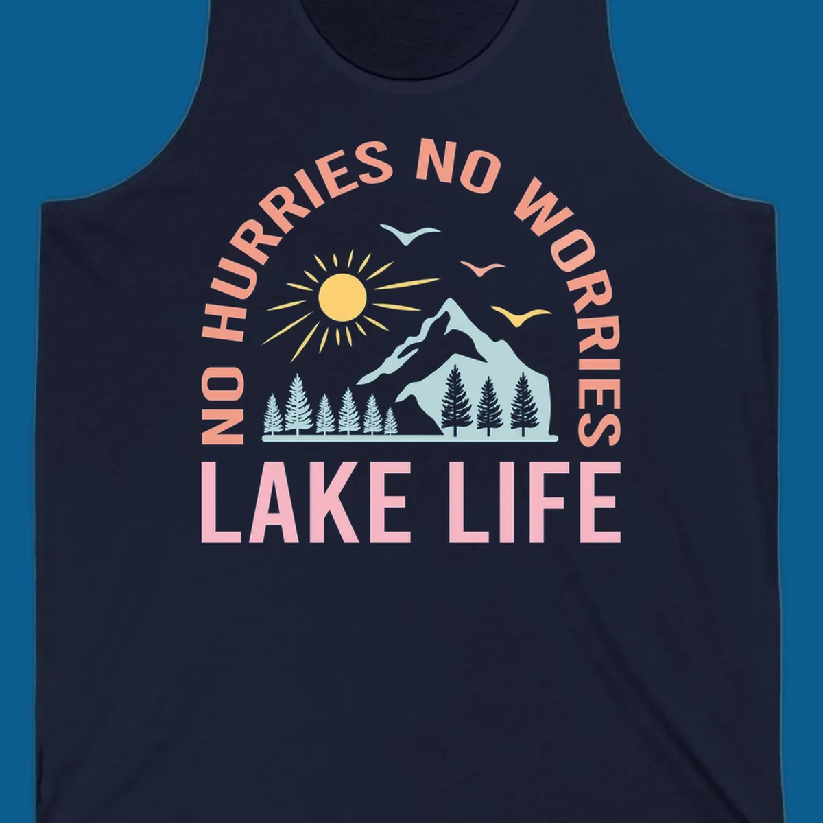 Lake life scenic design with mountains, sun, trees, and no worries text.