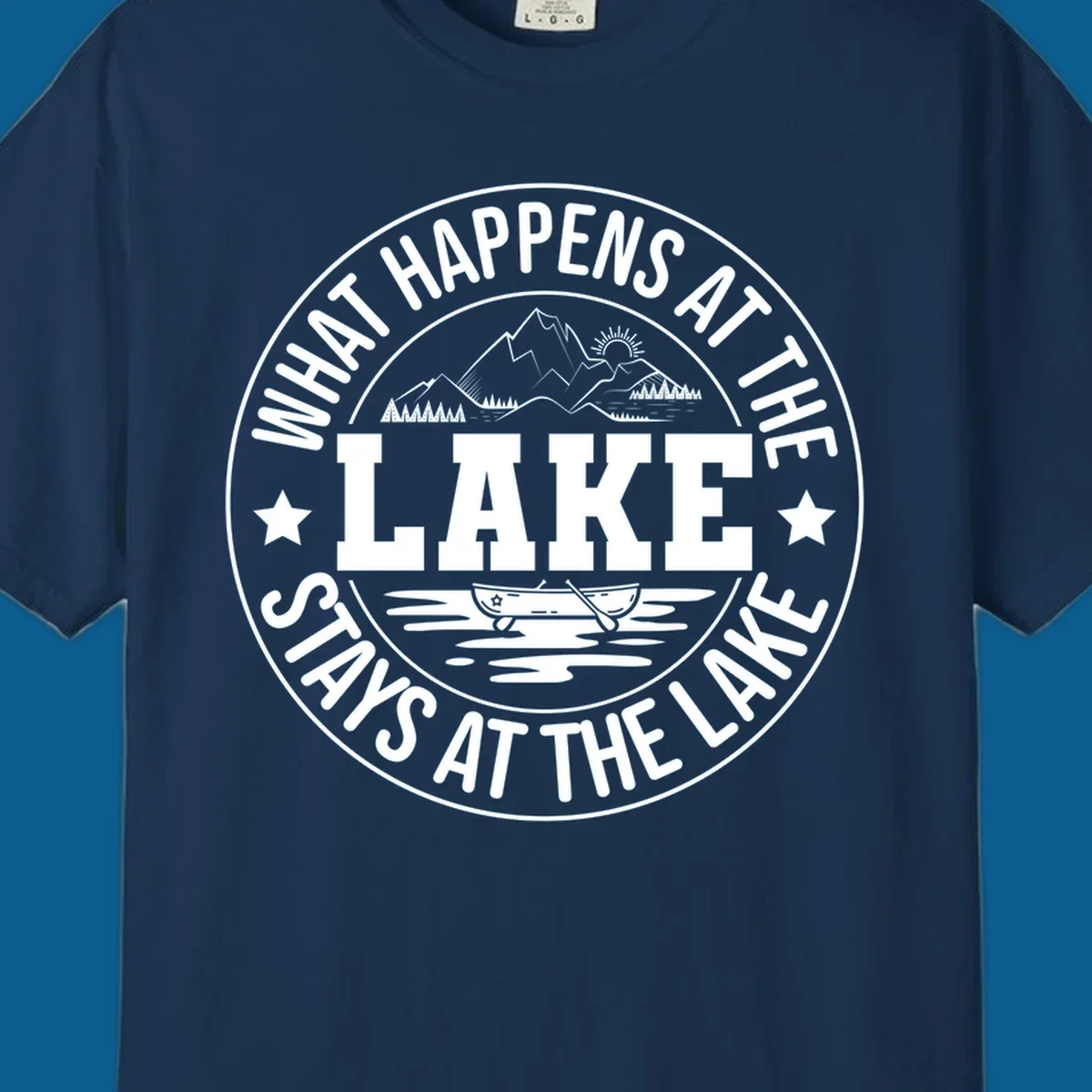 Circular badge with text 'What Happens At The Lake Stays At The Lake' and lake scene graphic.