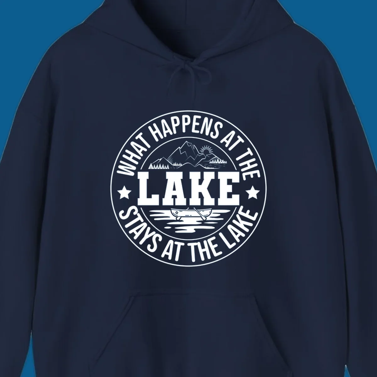 Circular badge with text 'What Happens At The Lake Stays At The Lake' and lake scene graphic.