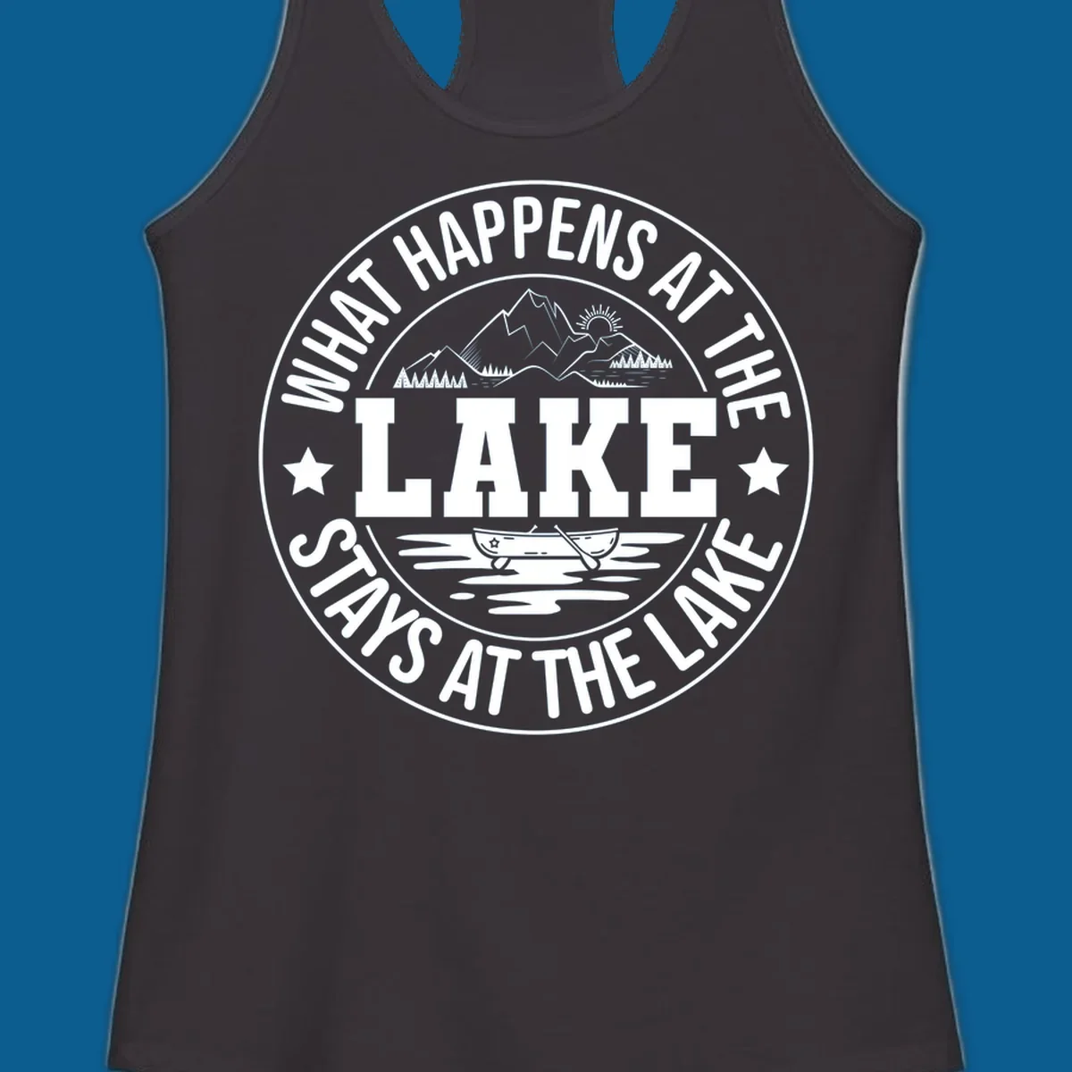 Circular badge with text 'What Happens At The Lake Stays At The Lake' and lake scene graphic.