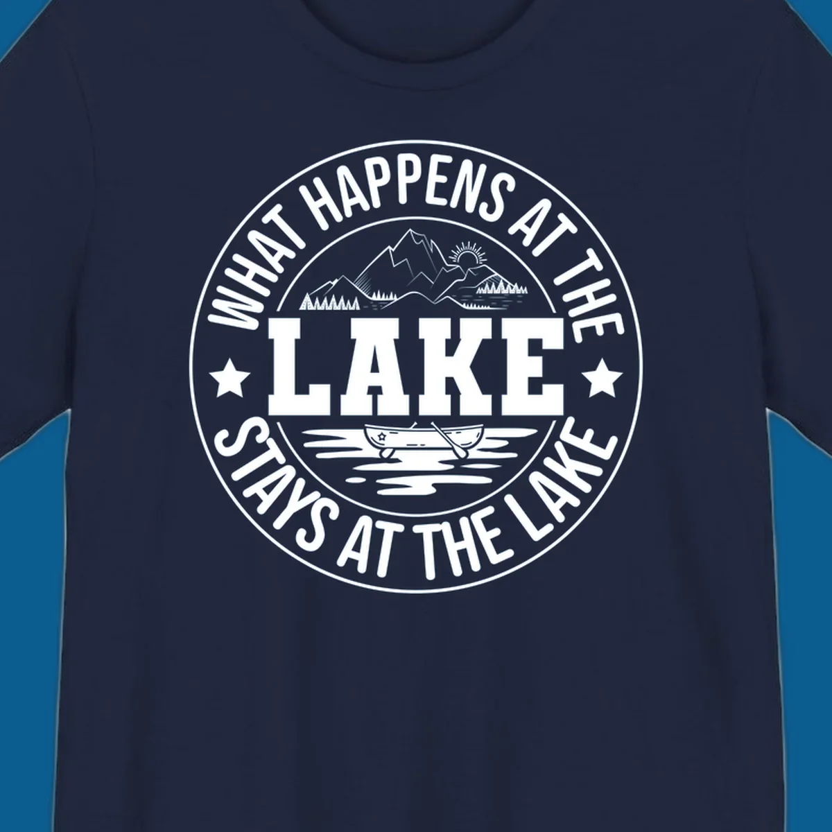 Circular badge with text 'What Happens At The Lake Stays At The Lake' and lake scene graphic.