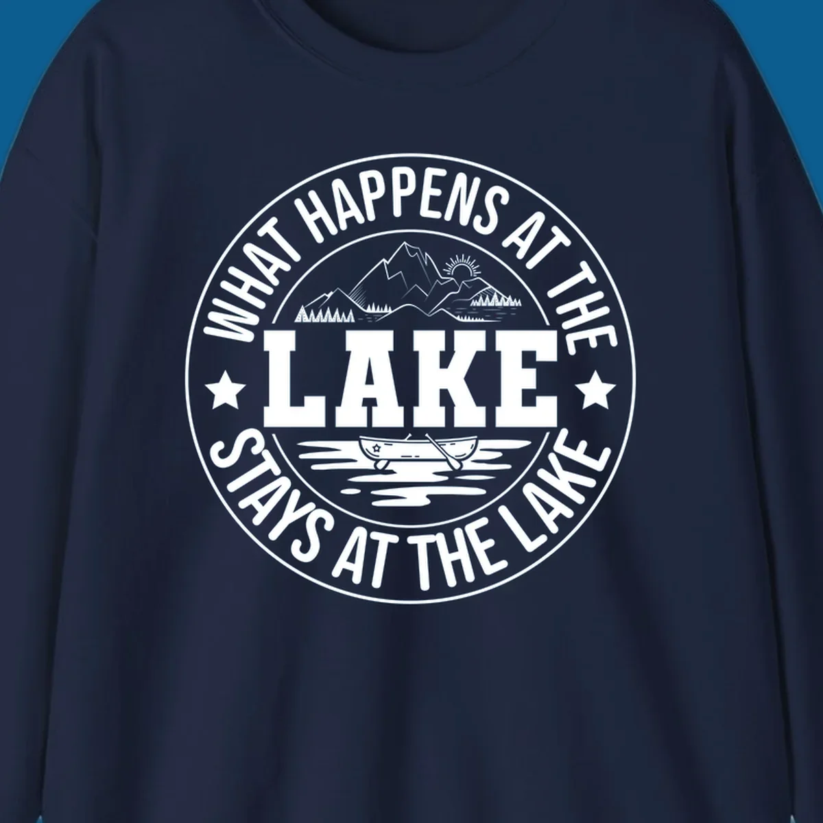 Circular badge with text 'What Happens At The Lake Stays At The Lake' and lake scene graphic.