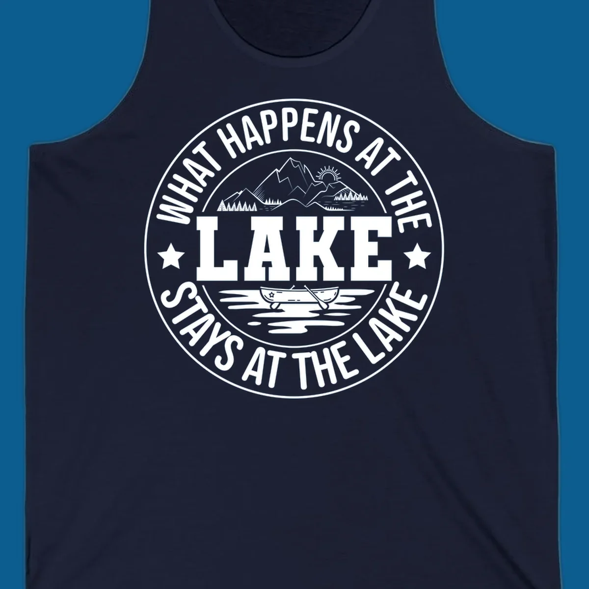 Circular badge with text 'What Happens At The Lake Stays At The Lake' and lake scene graphic.