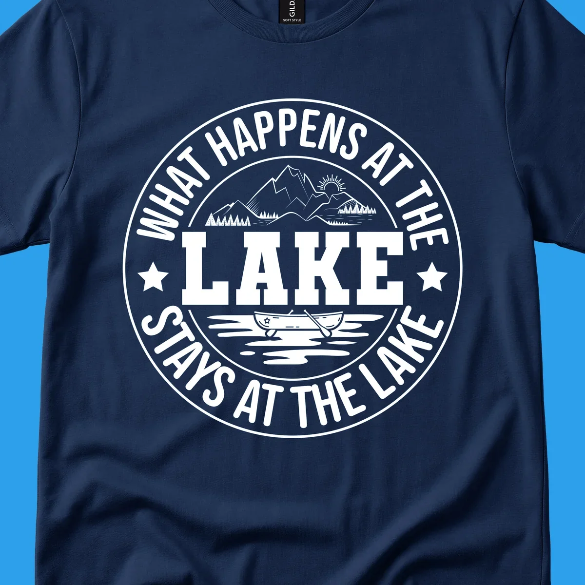 Circular badge with text 'What Happens At The Lake Stays At The Lake' and lake scene graphic.