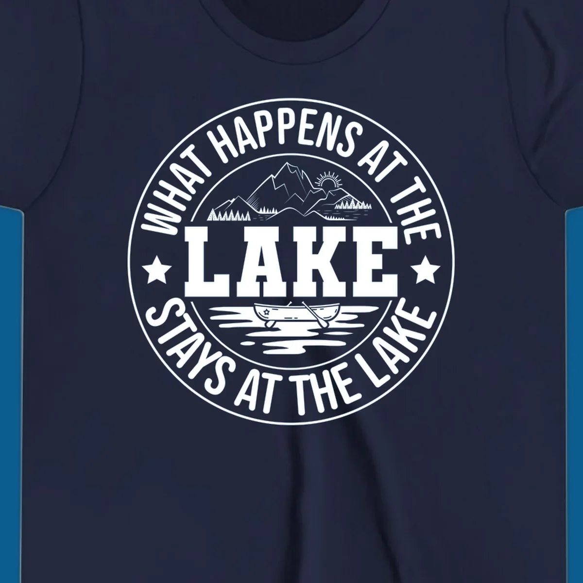 Circular badge with text 'What Happens At The Lake Stays At The Lake' and lake scene graphic.