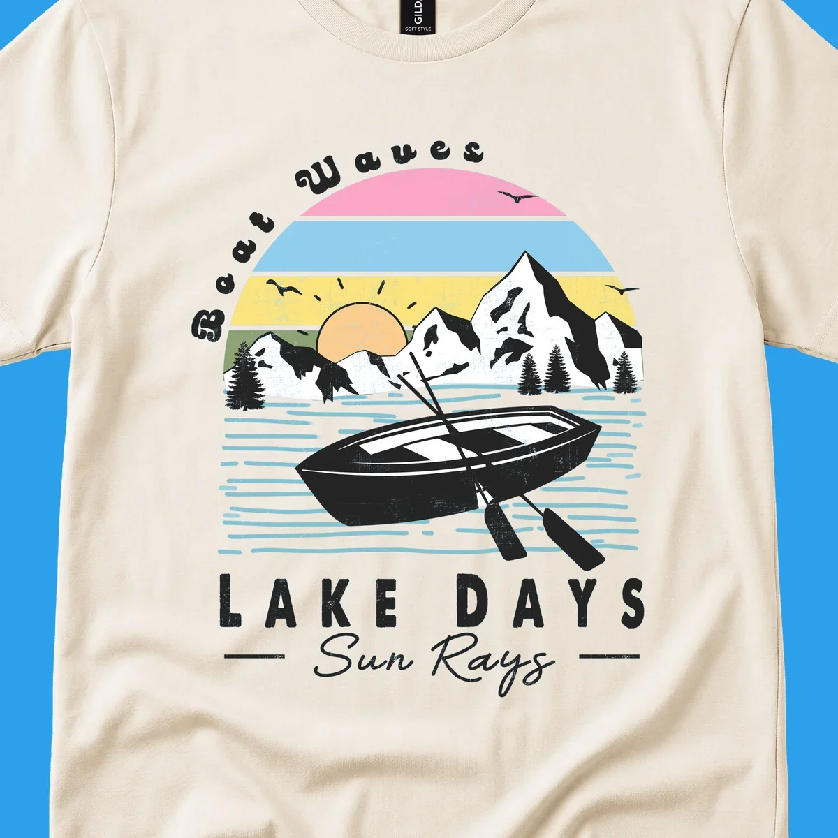Vintage lake boat scenic design with mountains and sun, text reads Boat Waves, LAKE DAYS Sun Rays.