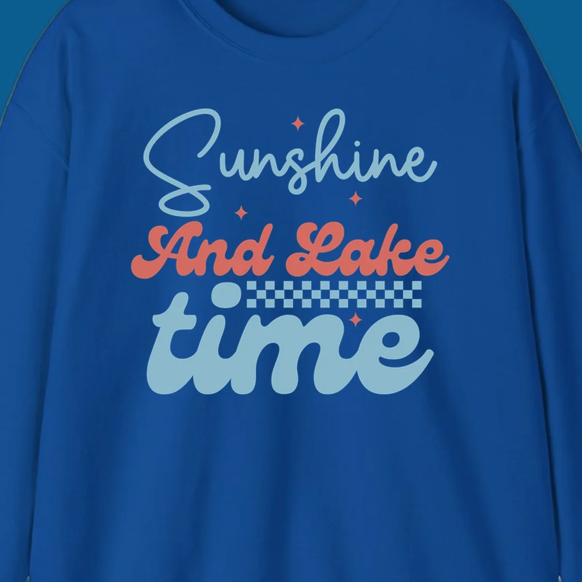 Retro sunshine and lake time text design with sparkle accents and checkerboard pattern.
