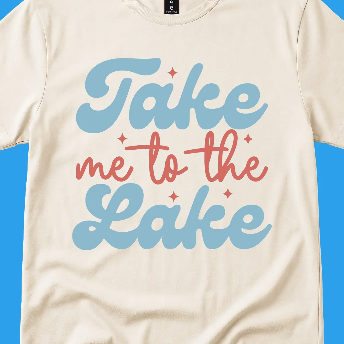 Retro 'Take me to the lake' text design with blue and coral lettering and white starbursts.