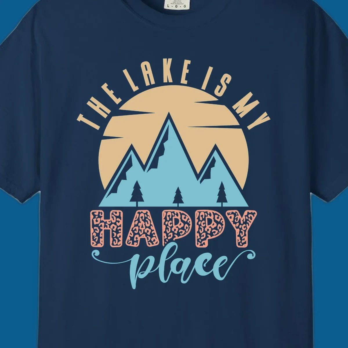 Illustration of mountains and sun with text 'The Lake Is My Happy Place' and leopard print.