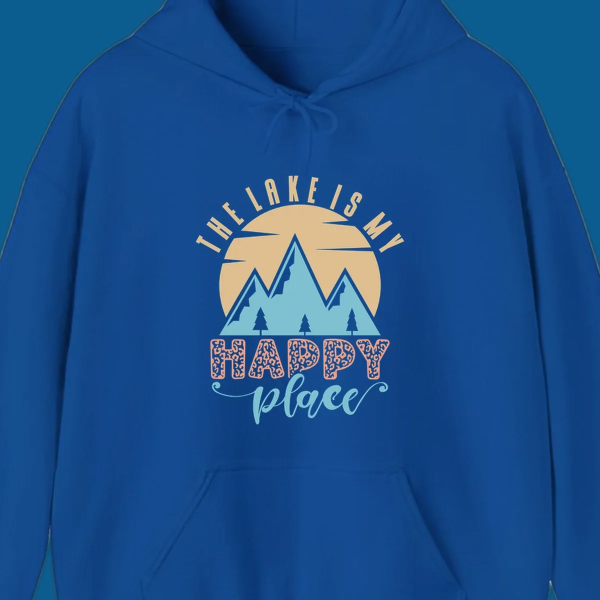 Illustration of mountains and sun with text 'The Lake Is My Happy Place' and leopard print.