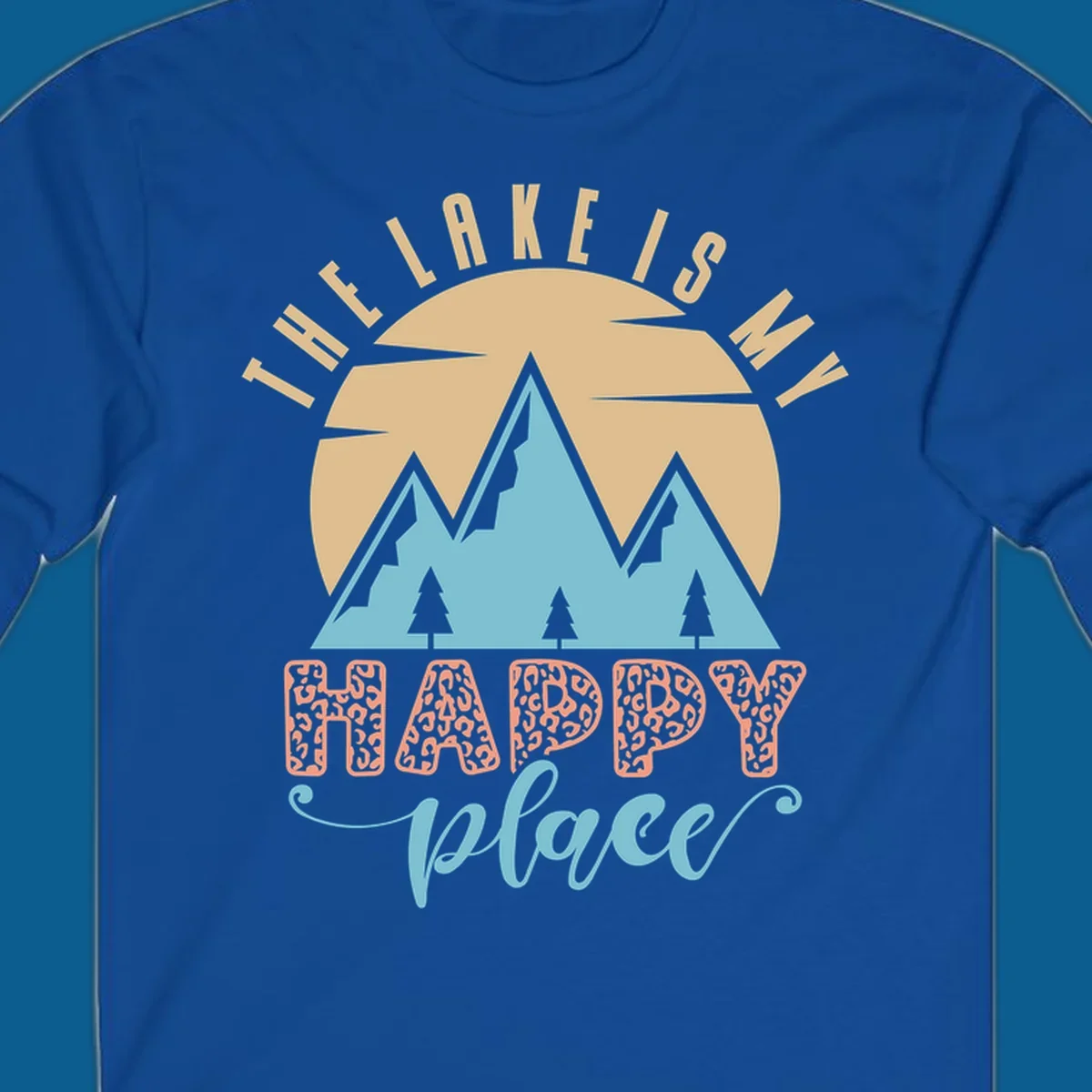 Illustration of mountains and sun with text 'The Lake Is My Happy Place' and leopard print.