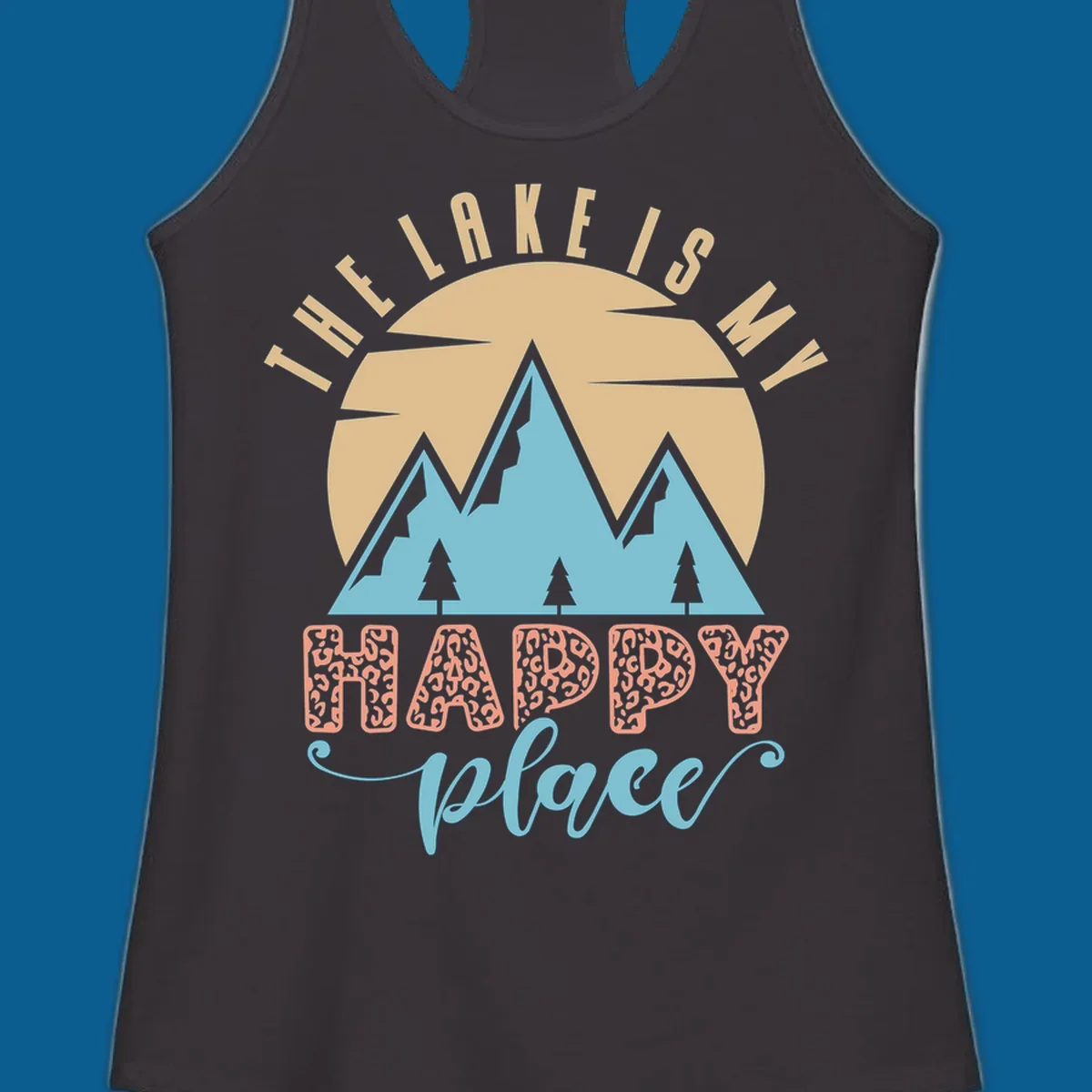 Illustration of mountains and sun with text 'The Lake Is My Happy Place' and leopard print.