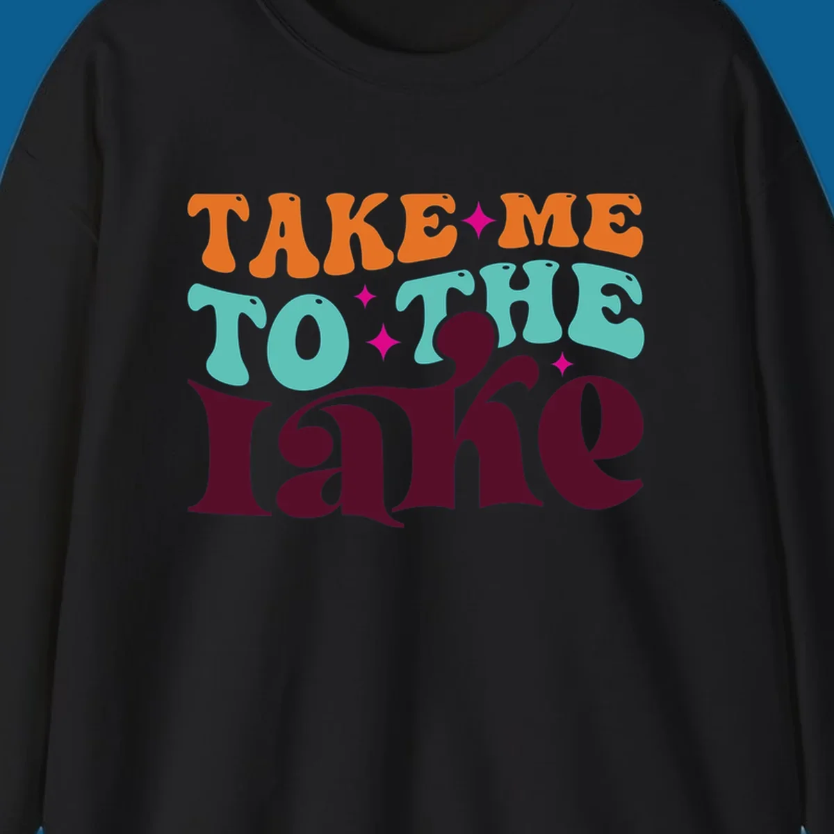 Retro typography design with the phrase 'TAKE ME TO THE lake' in orange, teal, and purple.