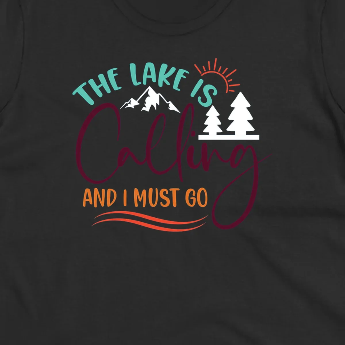 The Lake Is Calling And I Must Go nature graphic with mountains, trees, and sun rays.