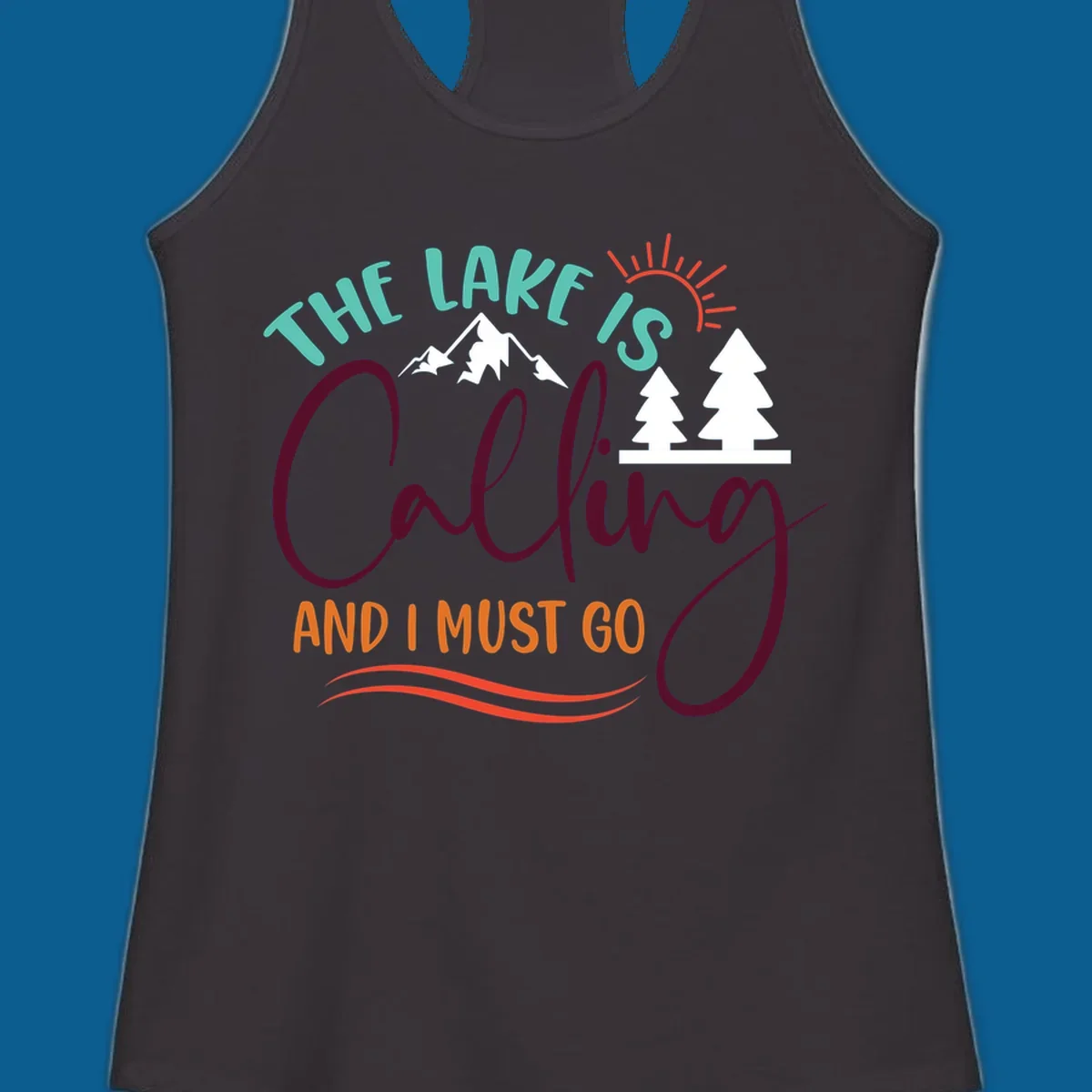 The Lake Is Calling And I Must Go nature graphic with mountains, trees, and sun rays.