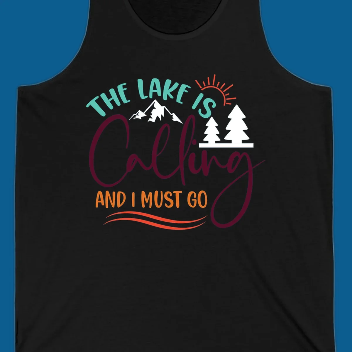 The Lake Is Calling And I Must Go nature graphic with mountains, trees, and sun rays.