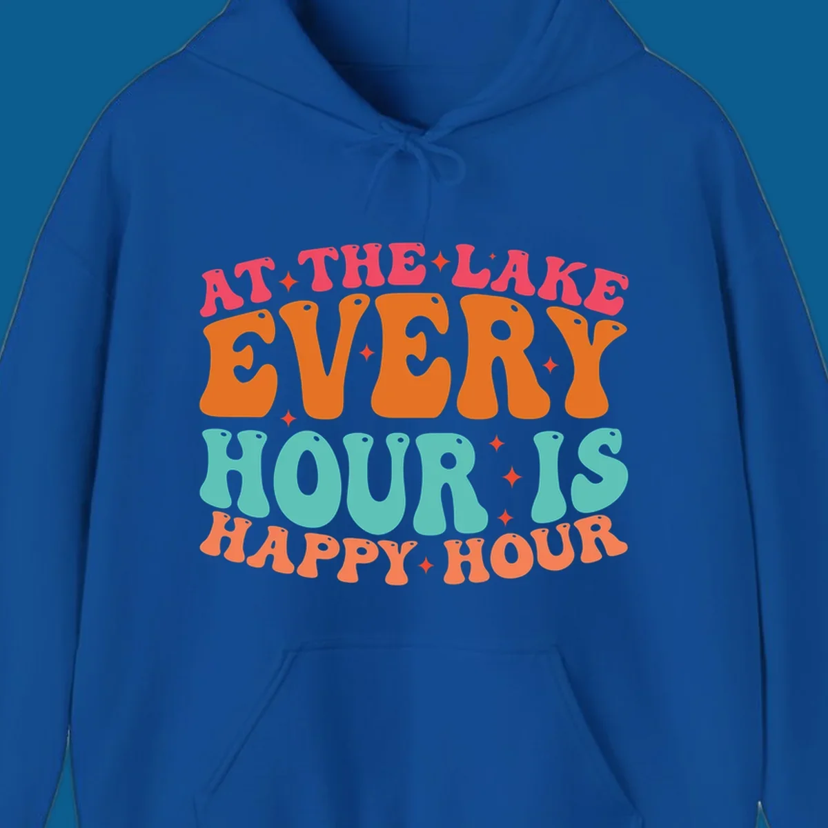 Retro text design that says "AT THE LAKE EVERY HOUR IS HAPPY HOUR" with starbursts, lake happy hour concept.