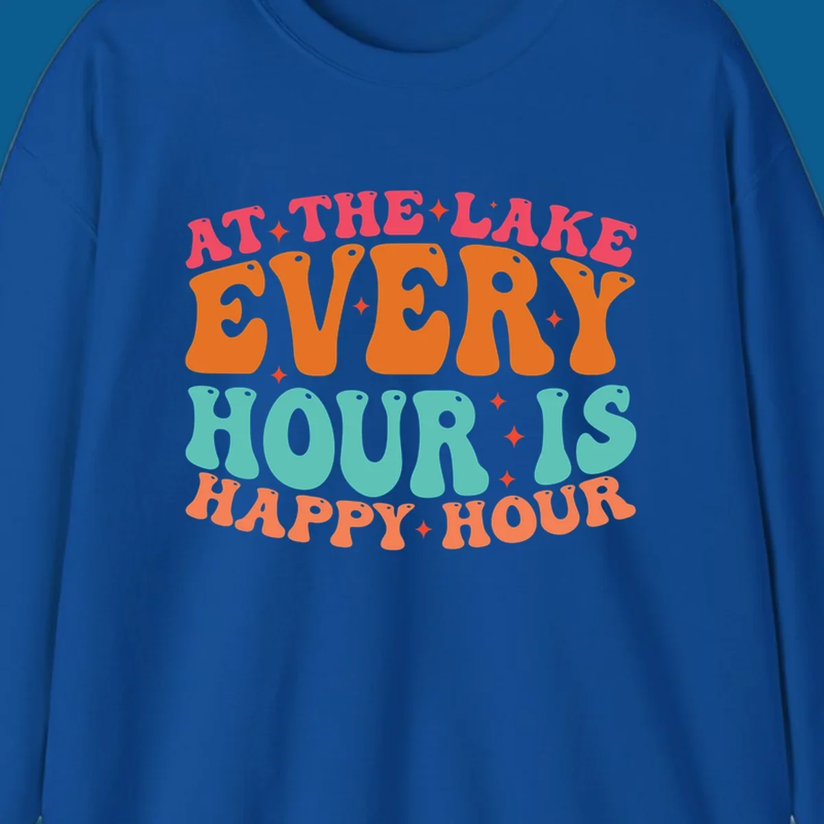 Retro text design that says "AT THE LAKE EVERY HOUR IS HAPPY HOUR" with starbursts, lake happy hour concept.