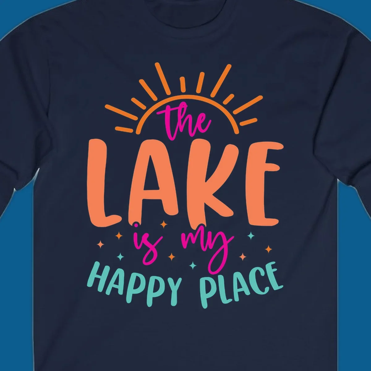 The lake is my happy place text design with sun rays and stars.