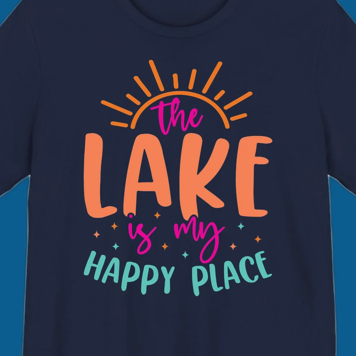 The lake is my happy place text design with sun rays and stars.