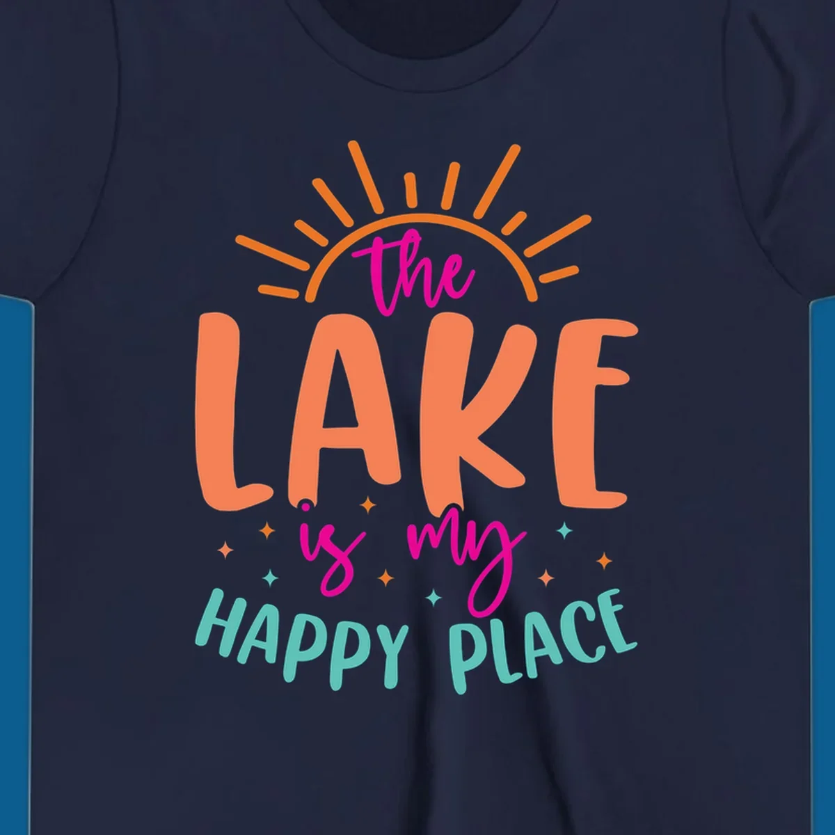 The lake is my happy place text design with sun rays and stars.