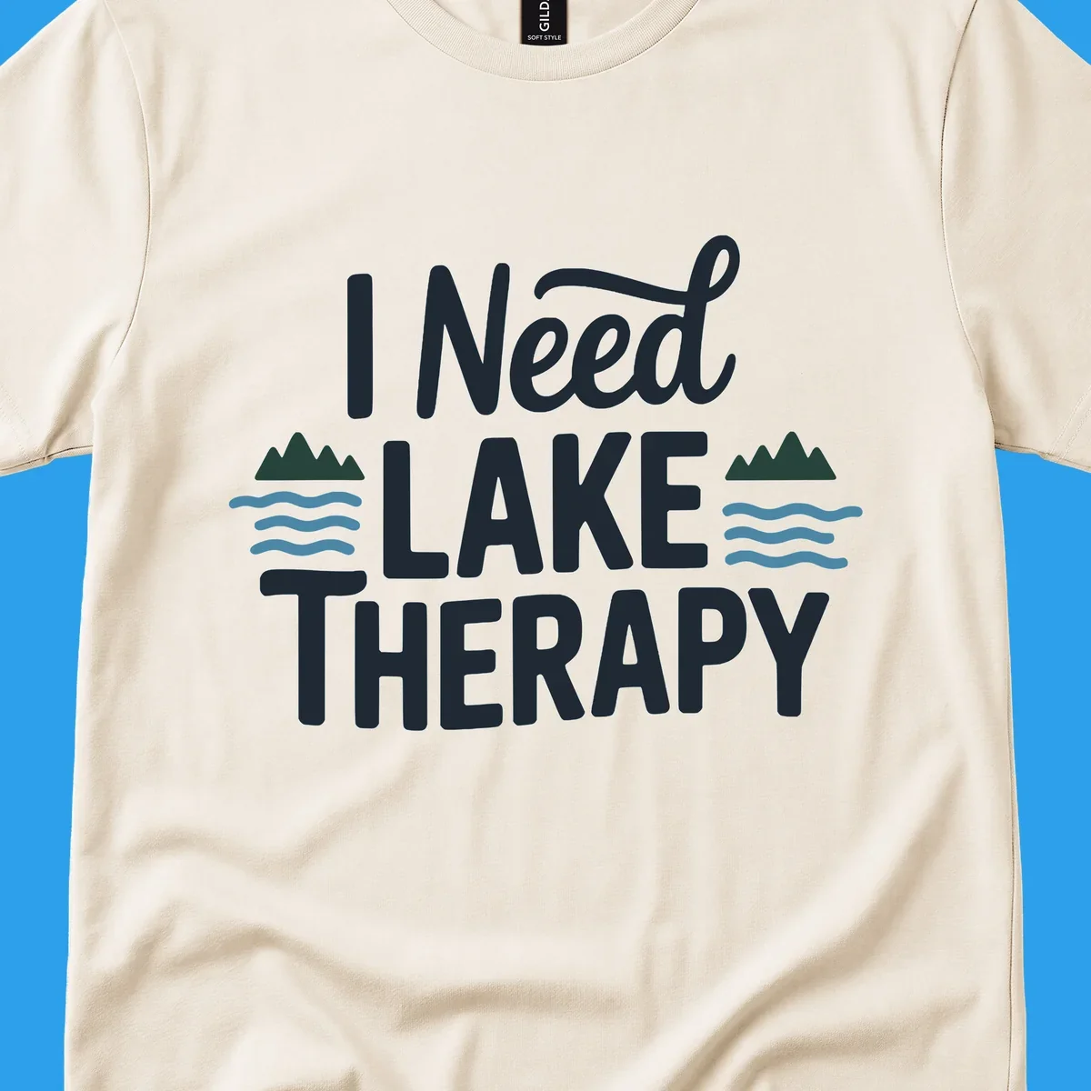 I Need Lake Therapy text with mountains and waves graphics