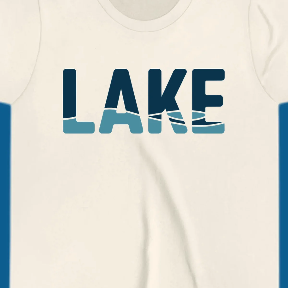Lake Life Shirt Co. logo with the word LAKE in dark blue with light blue water graphics at the bottom.