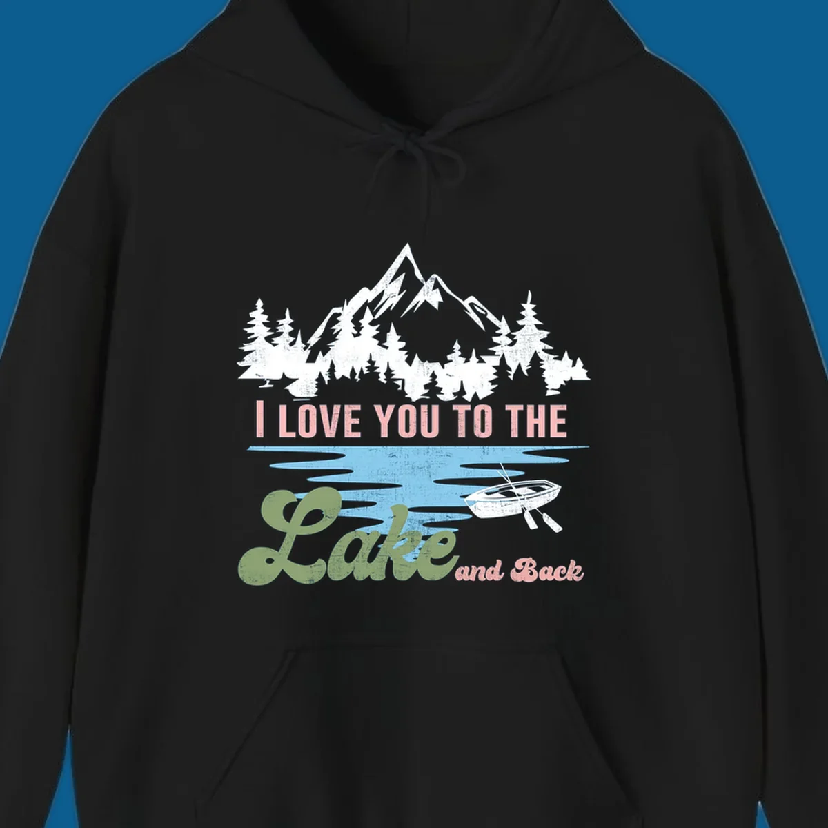 Illustration of mountains, pine trees, and a lake with the text 'I Love You To The Lake And Back', representing lake love escape.