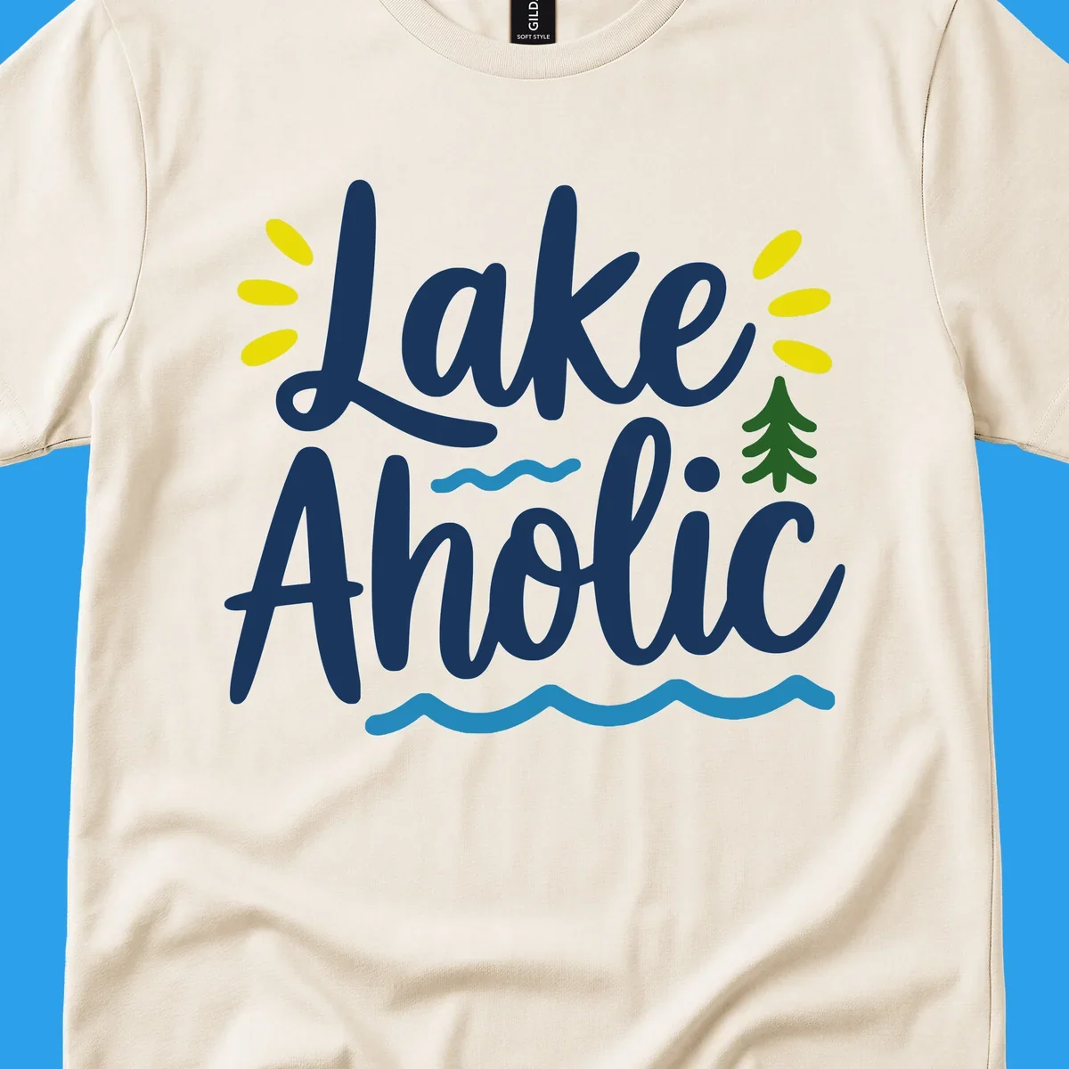 Lakeaholic text design with sun rays, pine tree, and water waves.
