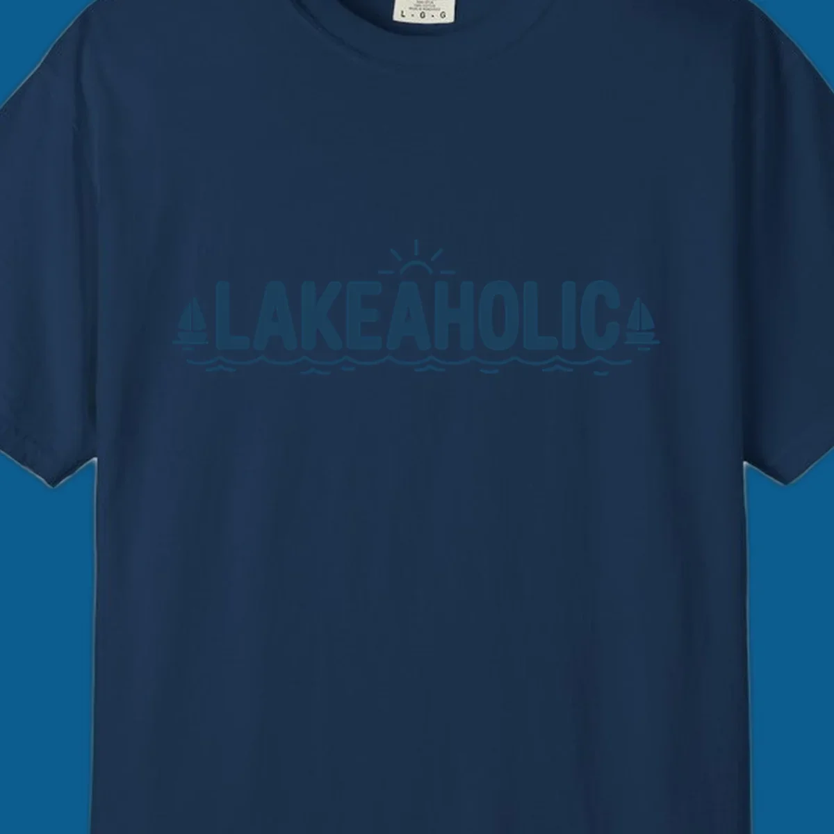 Lakeaholic typography with sun, sailboats, and waves graphic.