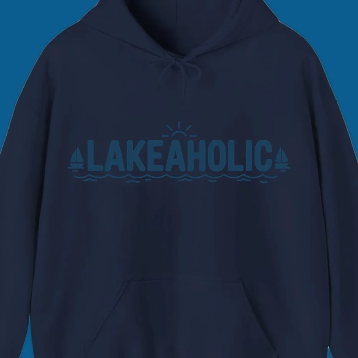 Lakeaholic typography with sun, sailboats, and waves graphic.