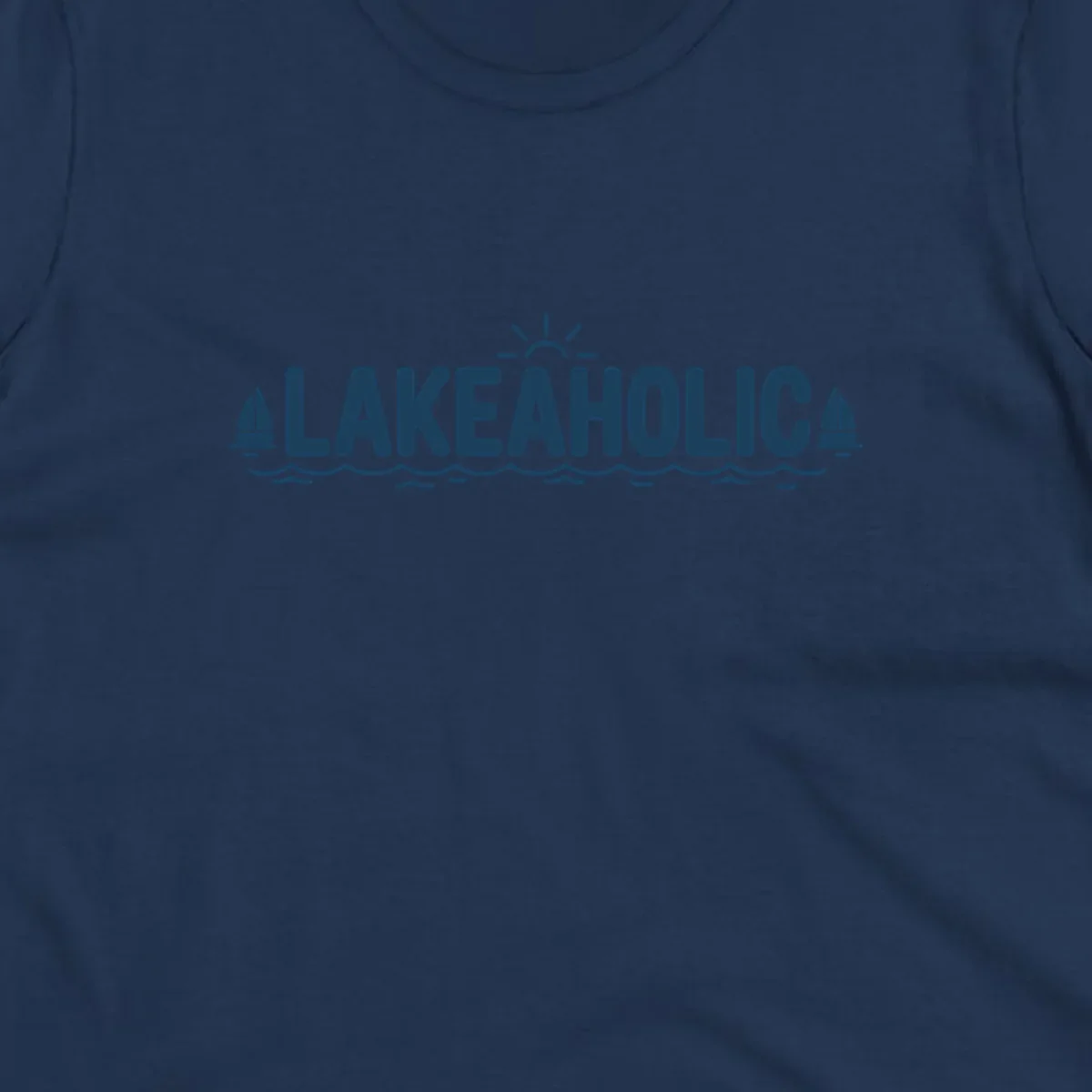 Lakeaholic typography with sun, sailboats, and waves graphic.