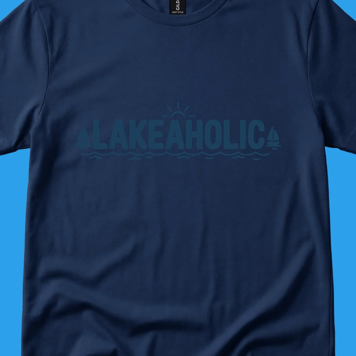 Lakeaholic typography with sun, sailboats, and waves graphic.