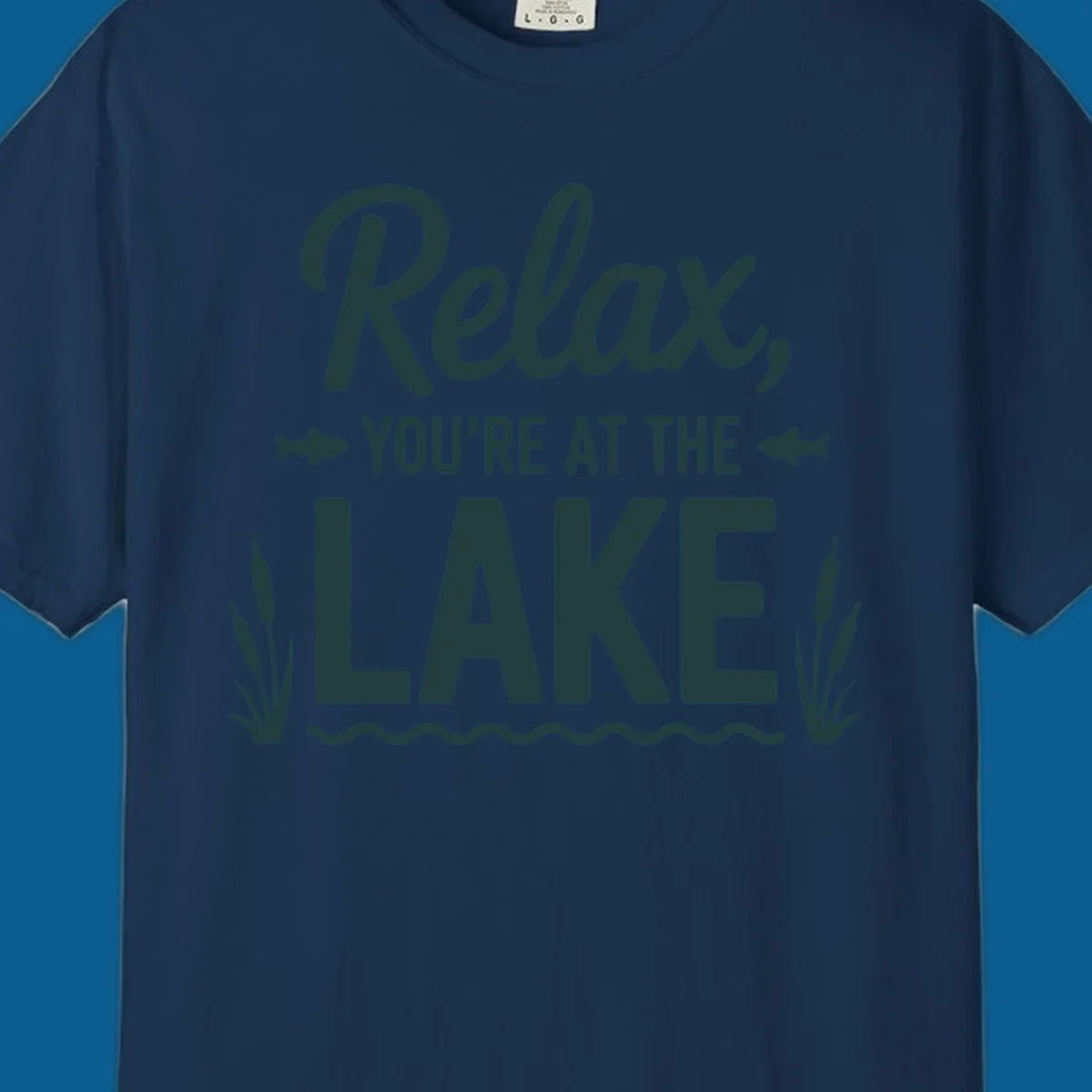 Relax you're at the lake typographic design with fish and cattails.