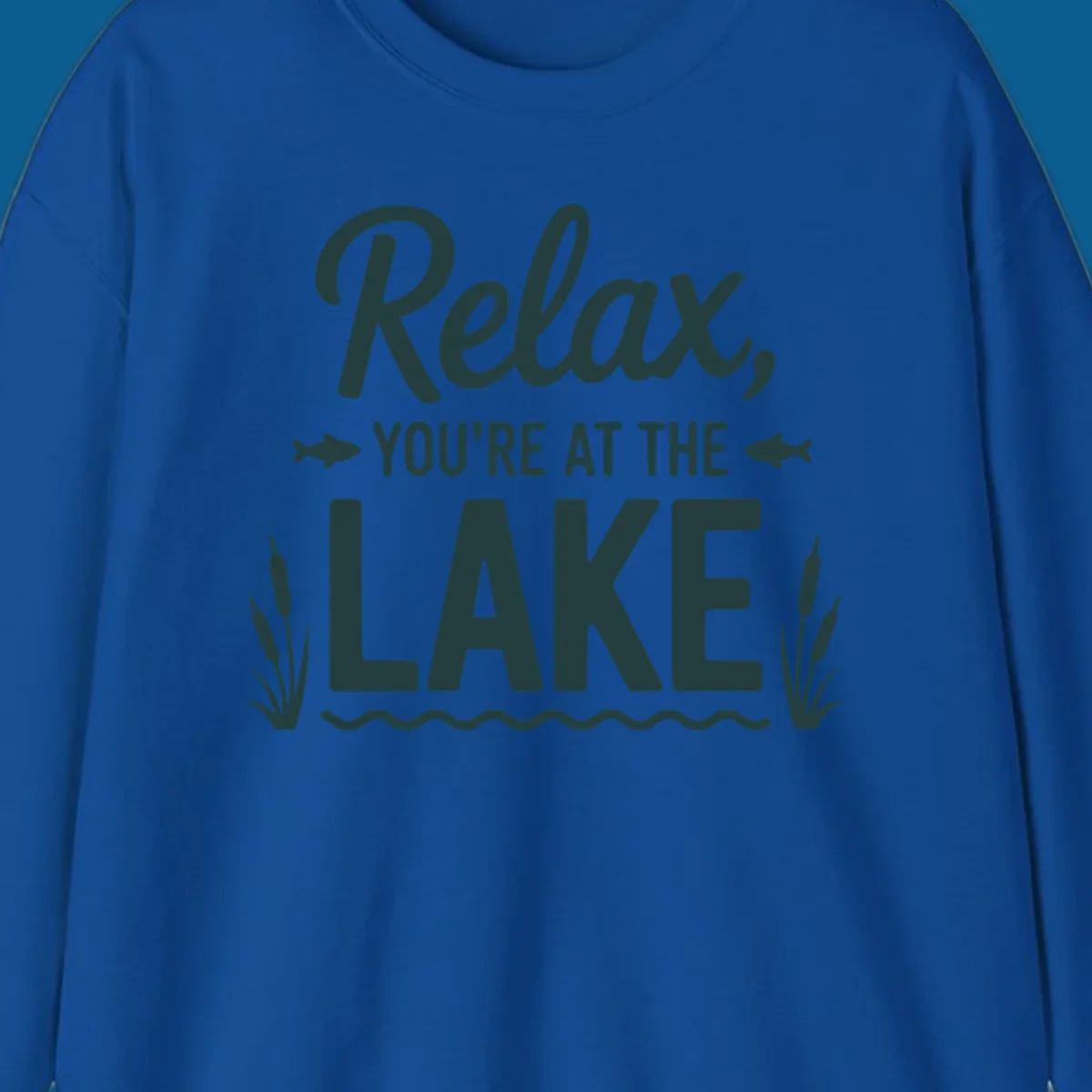 Relax you're at the lake typographic design with fish and cattails.