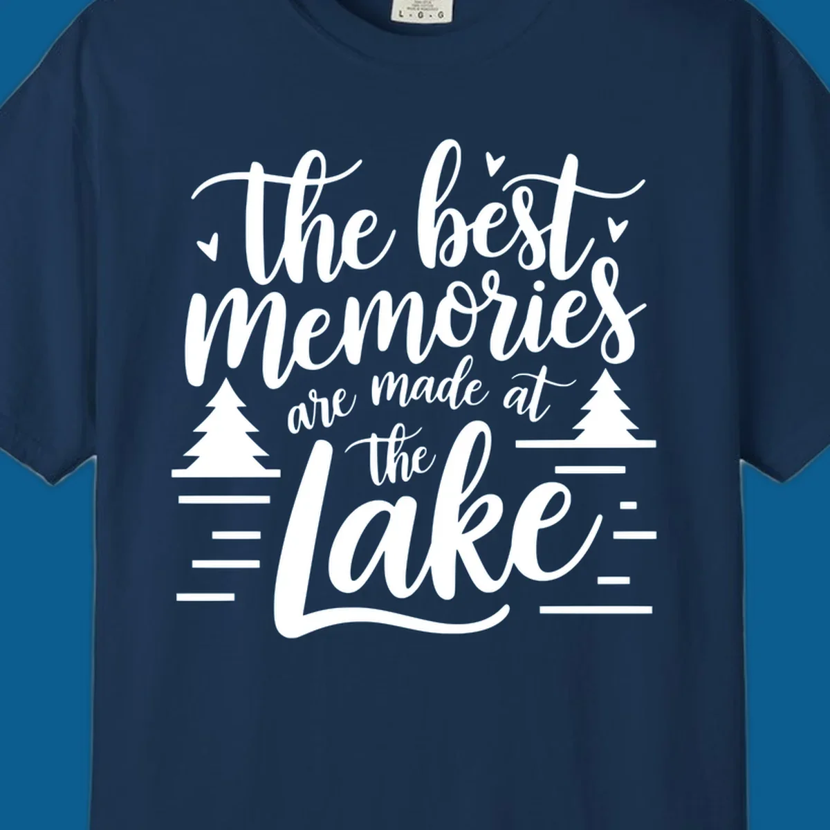 The best memories are made at the lake text with trees and water lines for lake life memories.