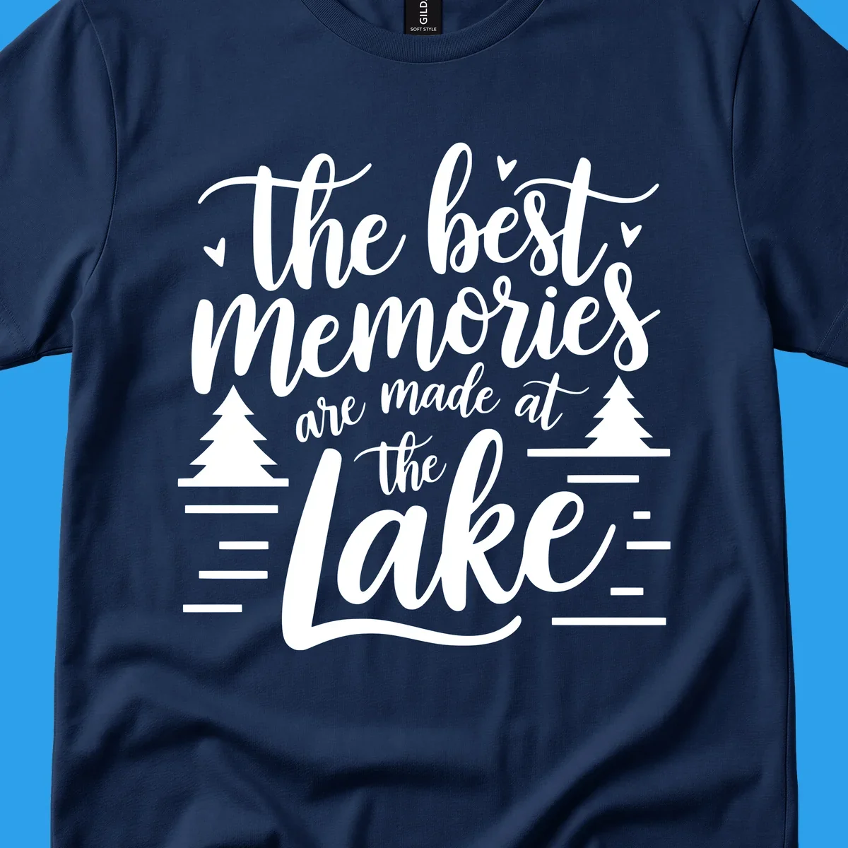 The best memories are made at the lake text with trees and water lines for lake life memories.