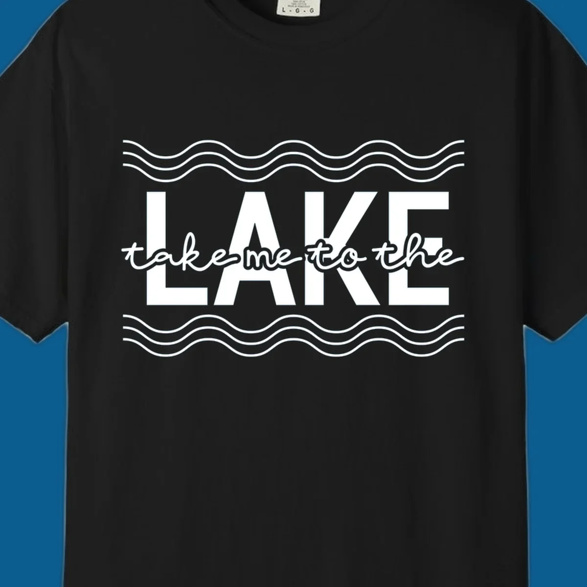 Lake life typography design with text 'take me to the LAKE' and wavy lines.