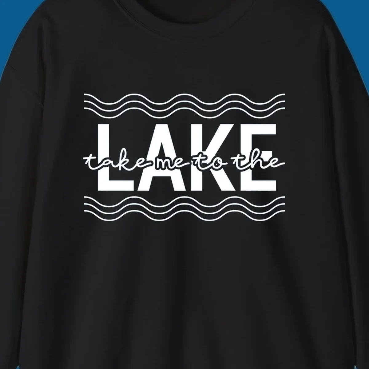 Lake life typography design with text 'take me to the LAKE' and wavy lines.