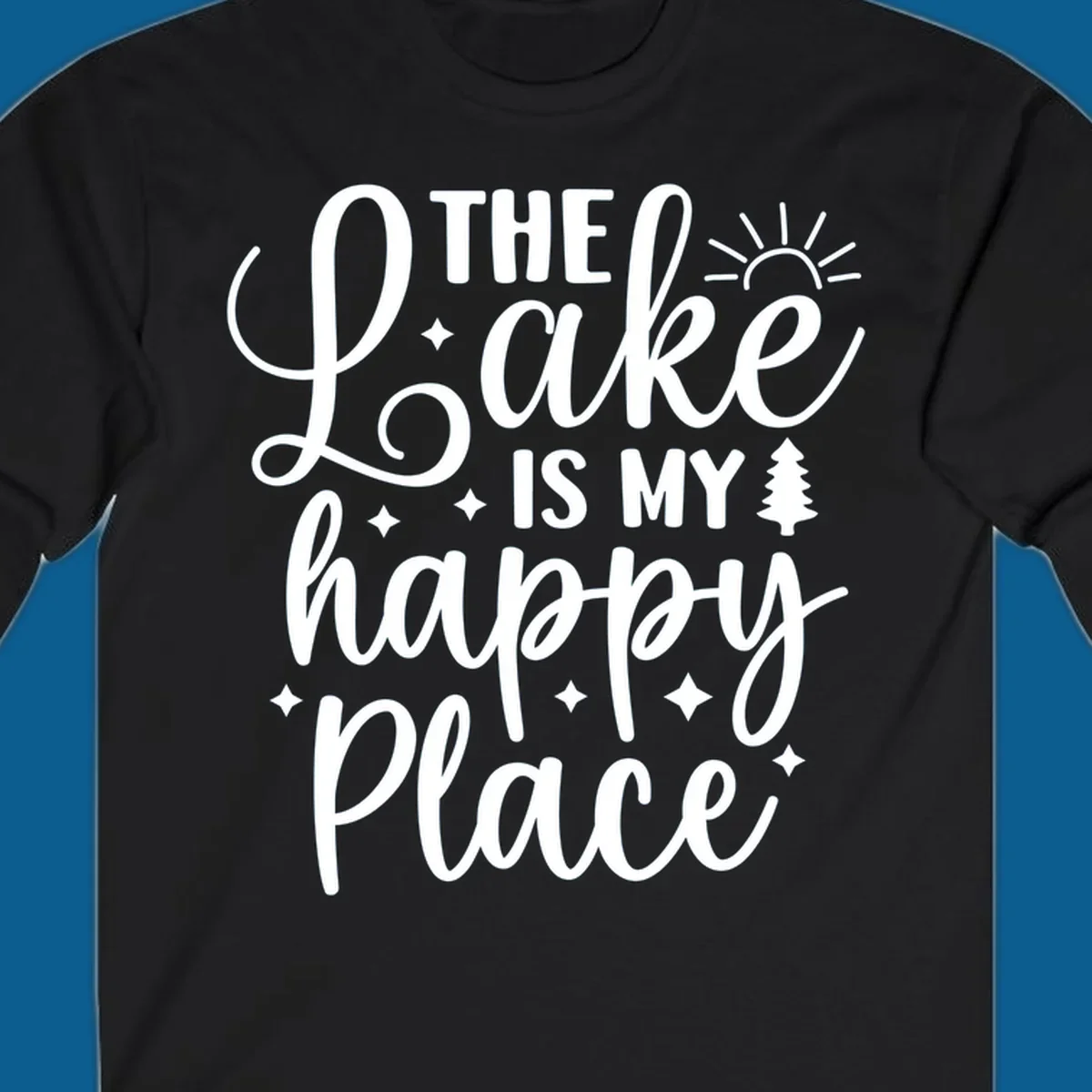 The Lake Is My Happy Place text and graphic design with sun, stars, and tree.