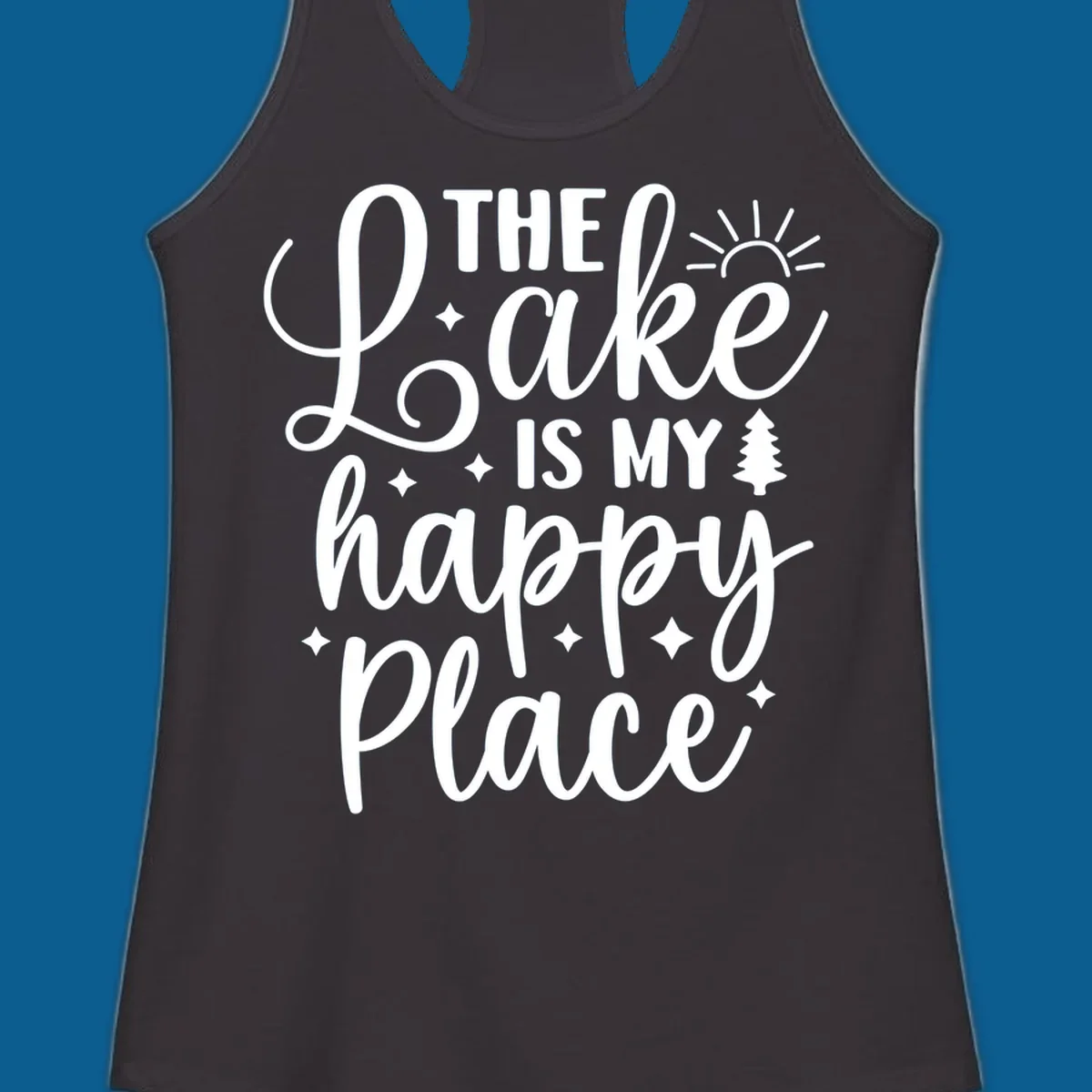 The Lake Is My Happy Place text and graphic design with sun, stars, and tree.
