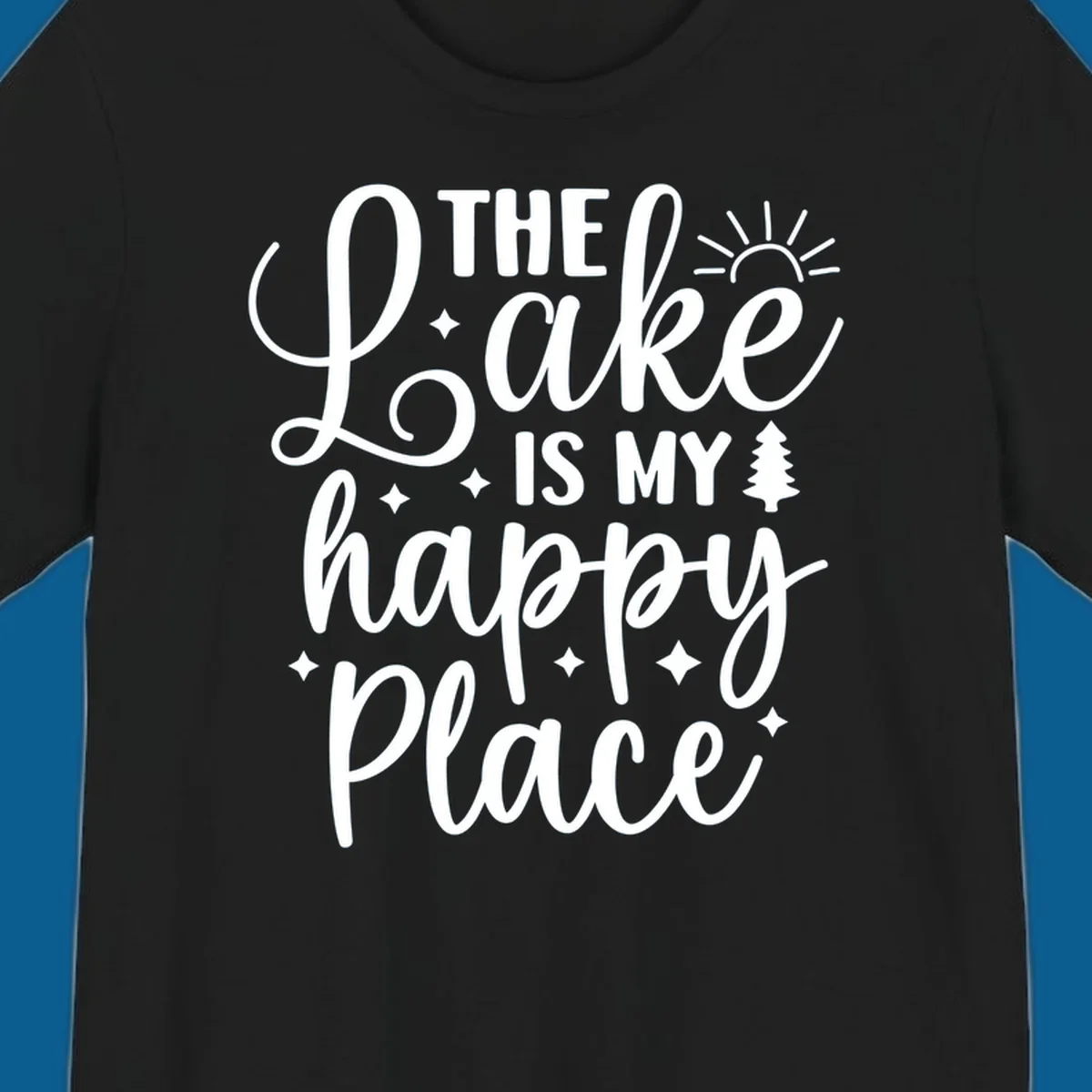 The Lake Is My Happy Place text and graphic design with sun, stars, and tree.
