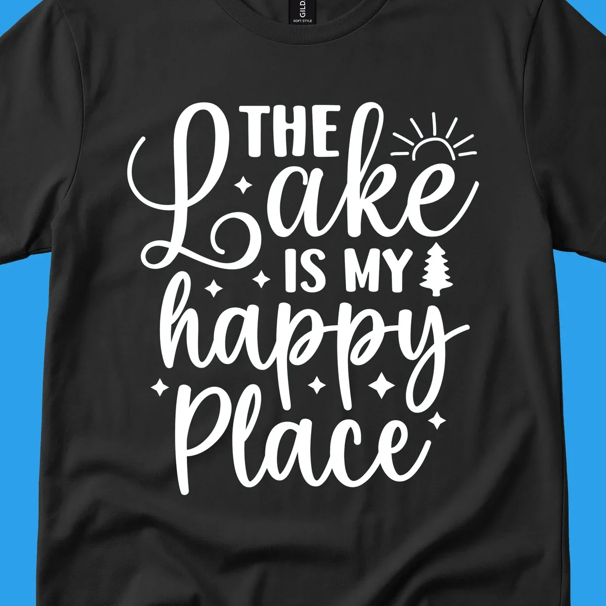 The Lake Is My Happy Place text and graphic design with sun, stars, and tree.
