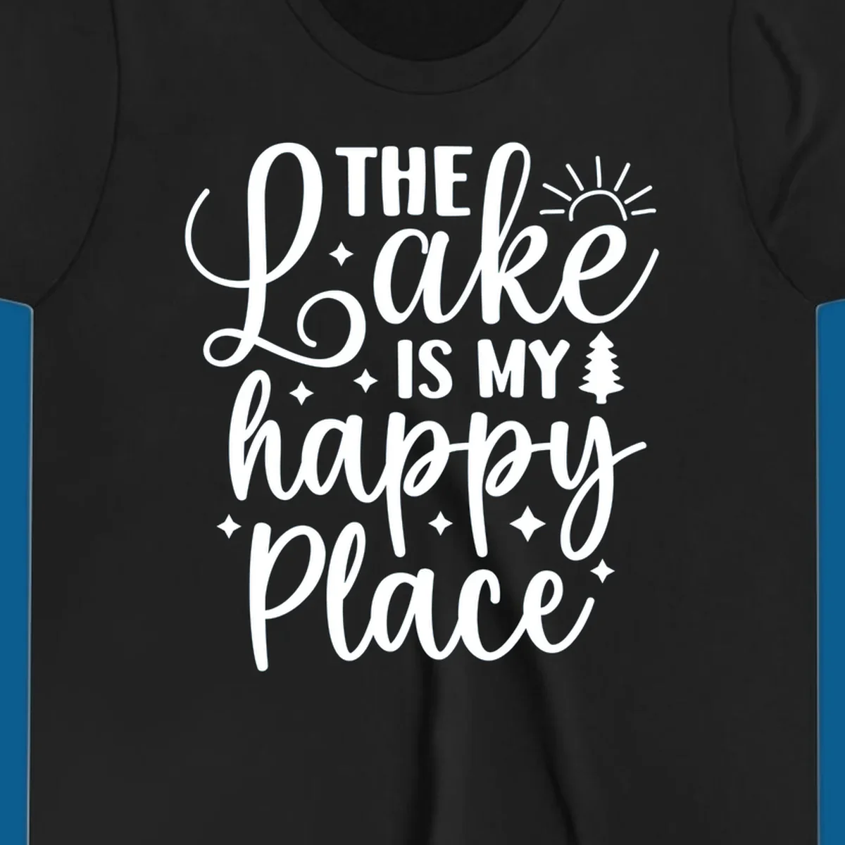 The Lake Is My Happy Place text and graphic design with sun, stars, and tree.