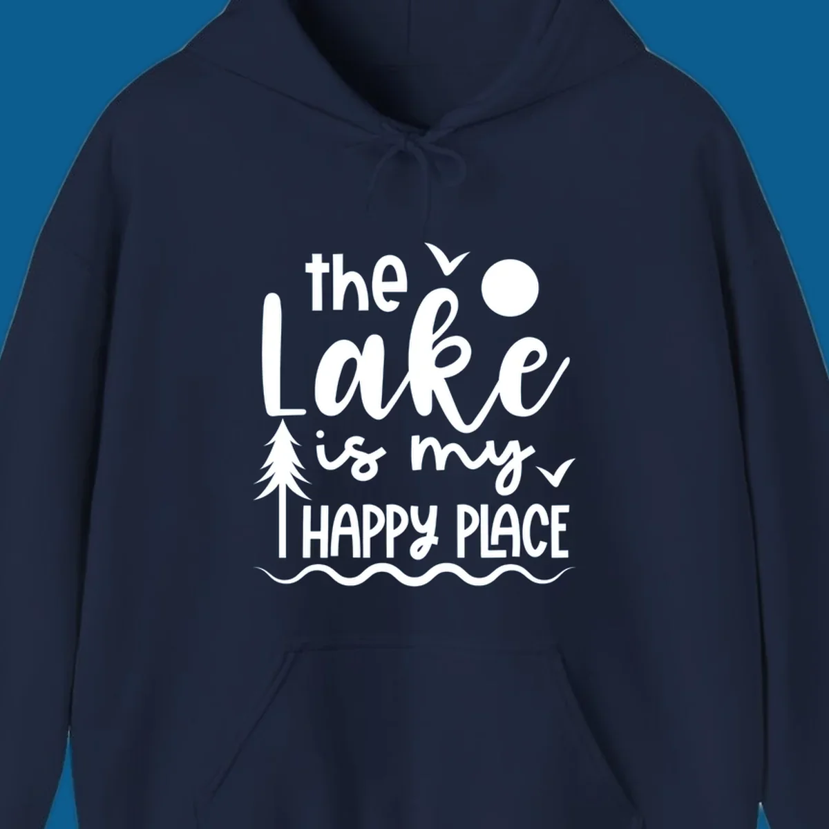The Lake Is My Happy Place text design with lake elements like a tree, sun, and birds.