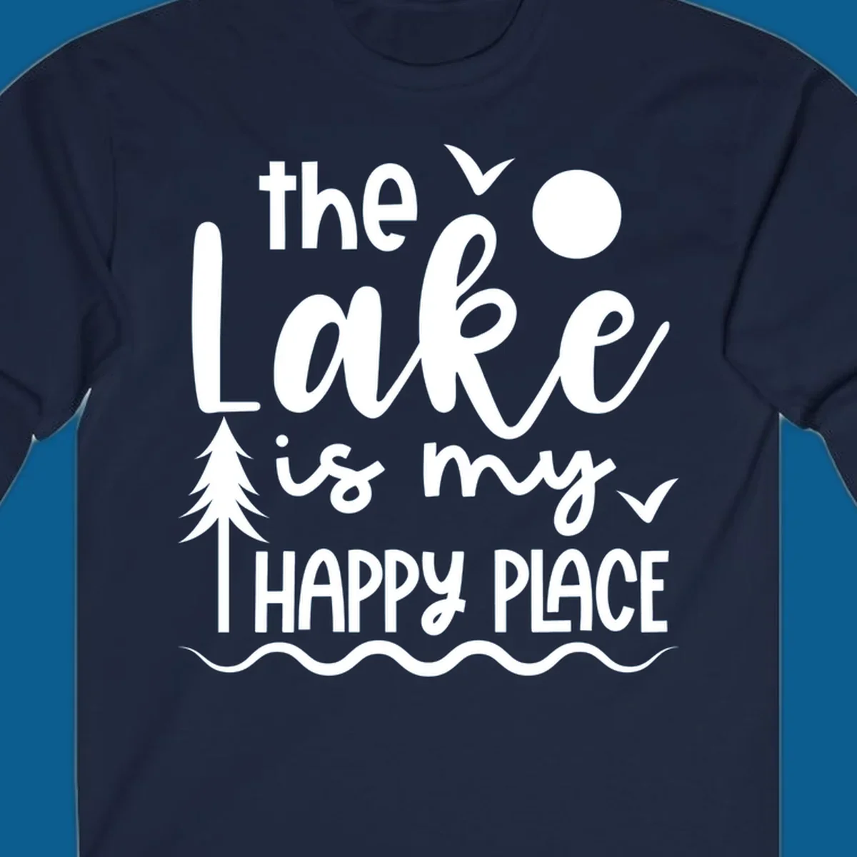 The Lake Is My Happy Place text design with lake elements like a tree, sun, and birds.