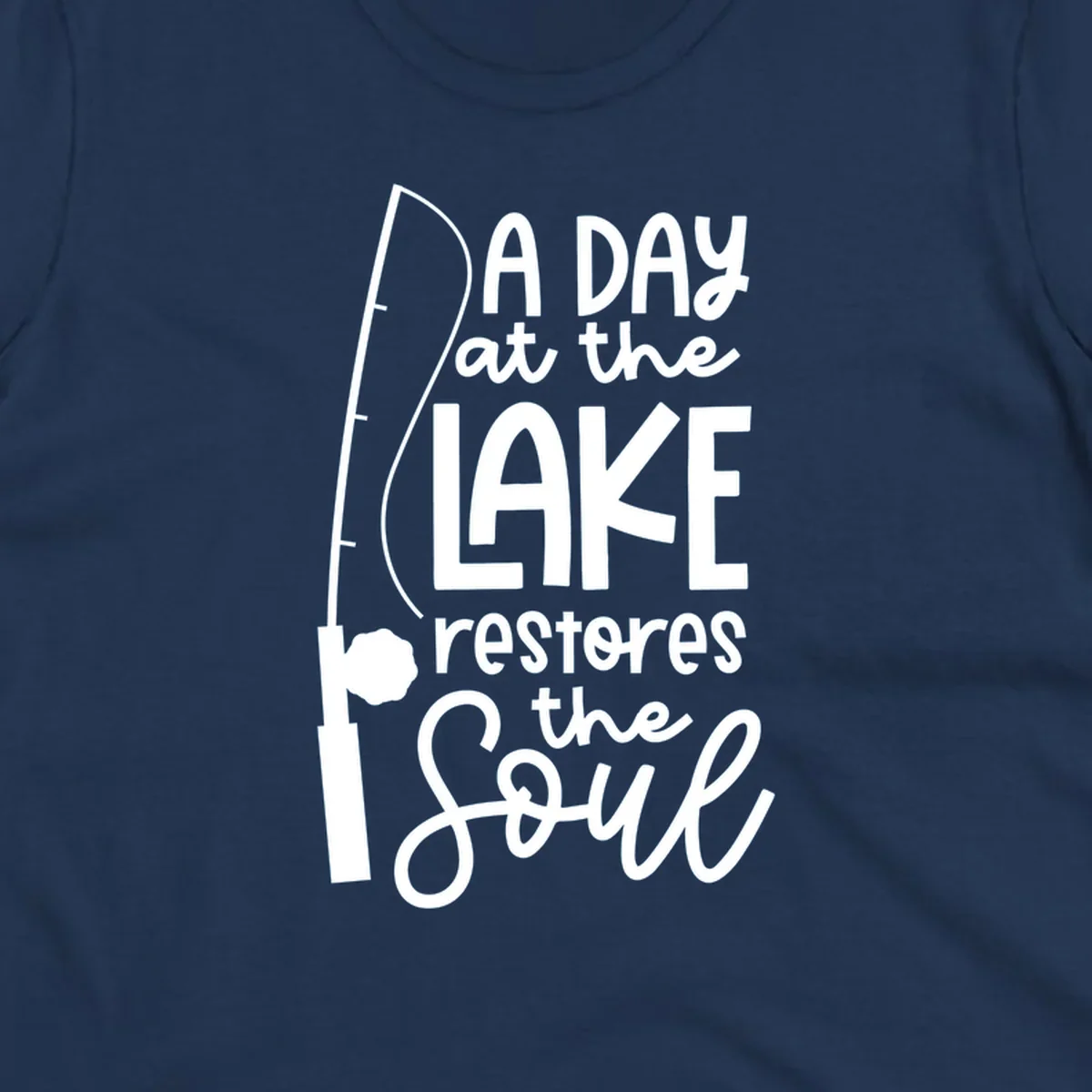 Fishing pole with text "A Day at the Lake Restores the Soul", lake-life concept.
