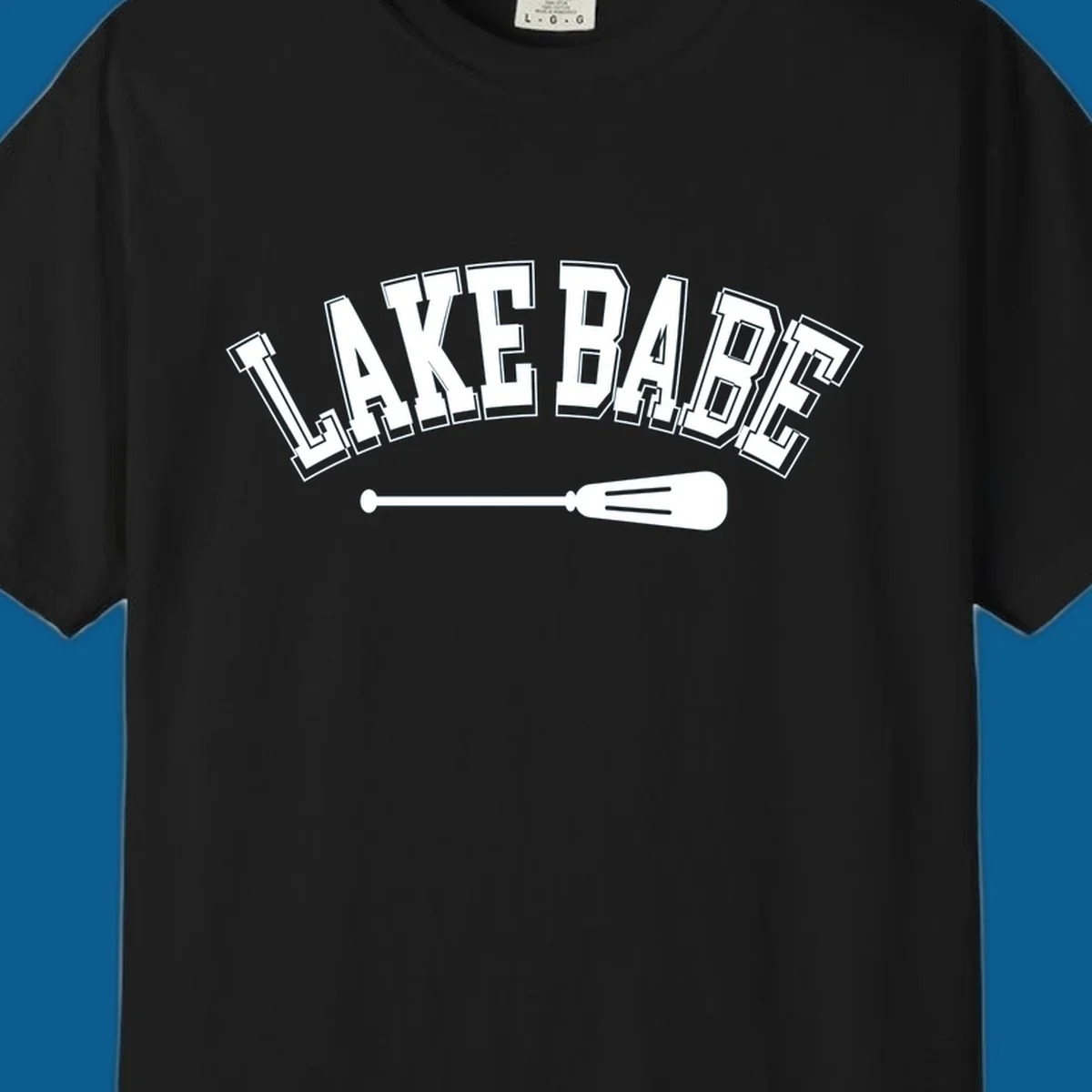 Arched text 'LAKE BABE' with an oar illustration below, representing lake-babe-style.
