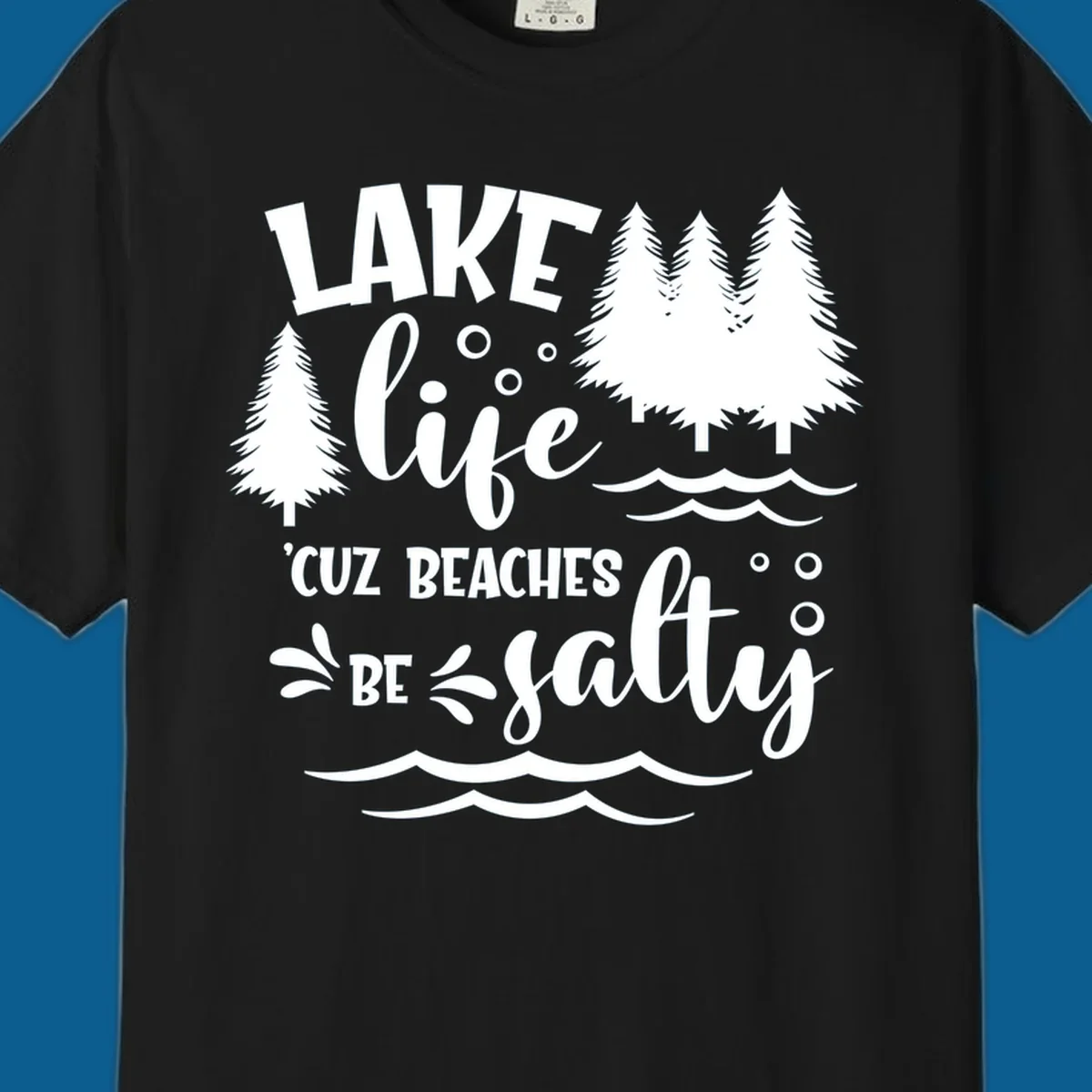 Lake life graphic with text 'LAKE life 'CUZ BEACHES BE salty', pine trees, and water waves.